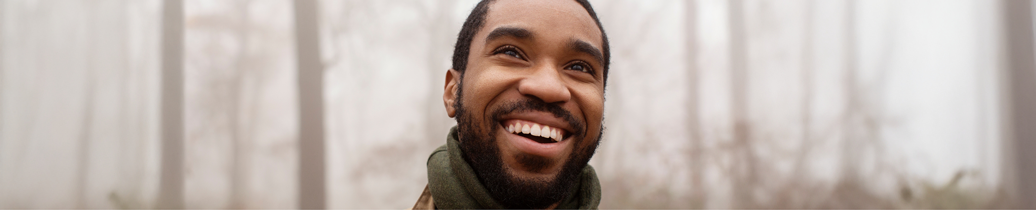 Man with short facial hair smiling