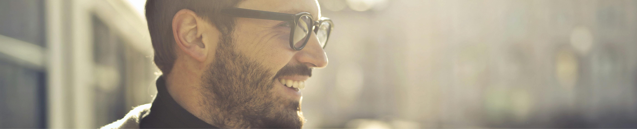 Man in glasses smiling after treatment with Botox in Port Charlotte