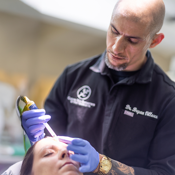 Doctor V applying Bio Fillers to a patient in their forehead