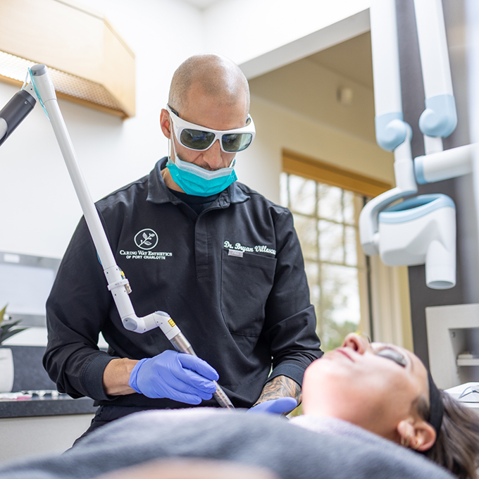 Doctor V performing an esthetic treatment on a patient