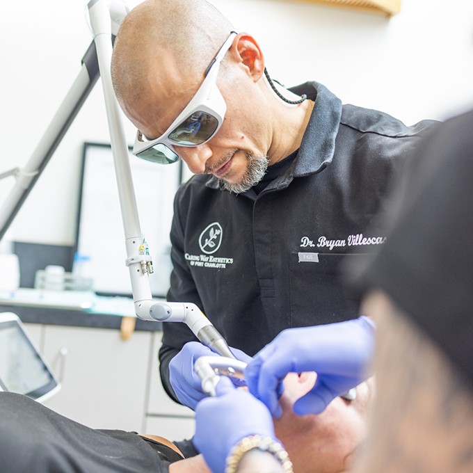 Doctor V wearing sunglasses while treating a patient
