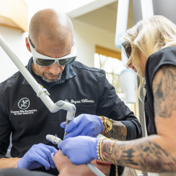 Doctor V and an assistant treating a patient