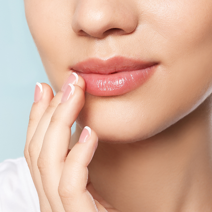 Close up of a woman touching her lip