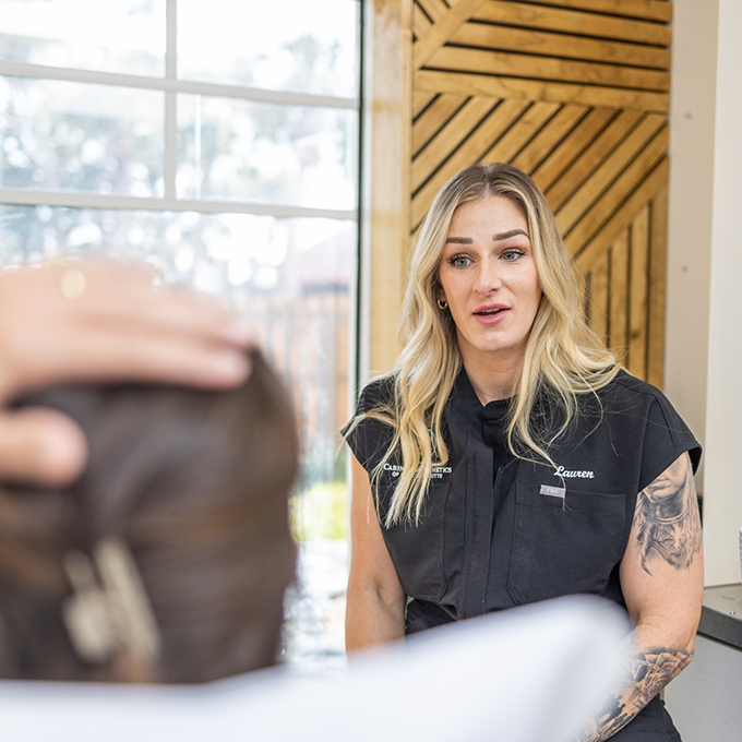 Esthetic team member talking to a patient