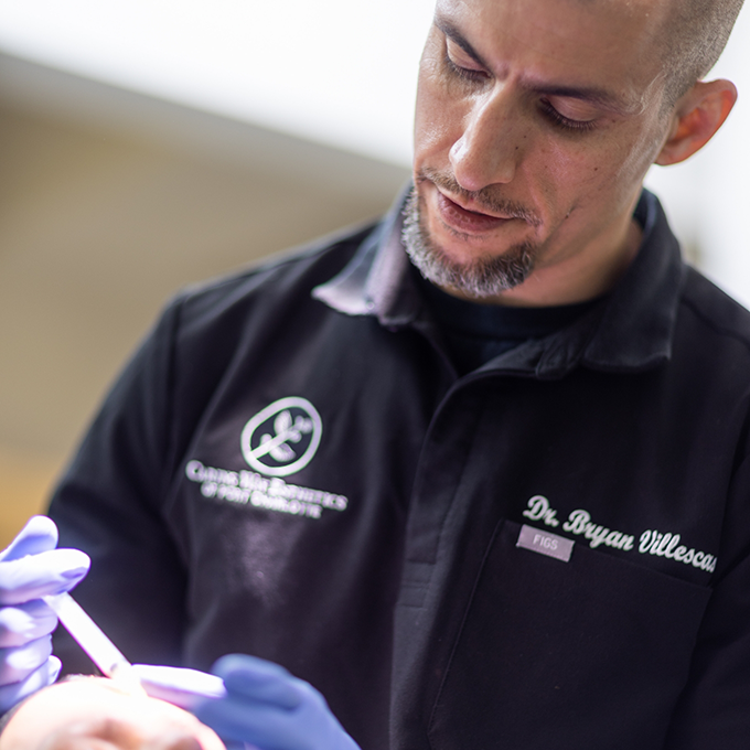 Doctor V applying platelet rich fibrin to a patients skin